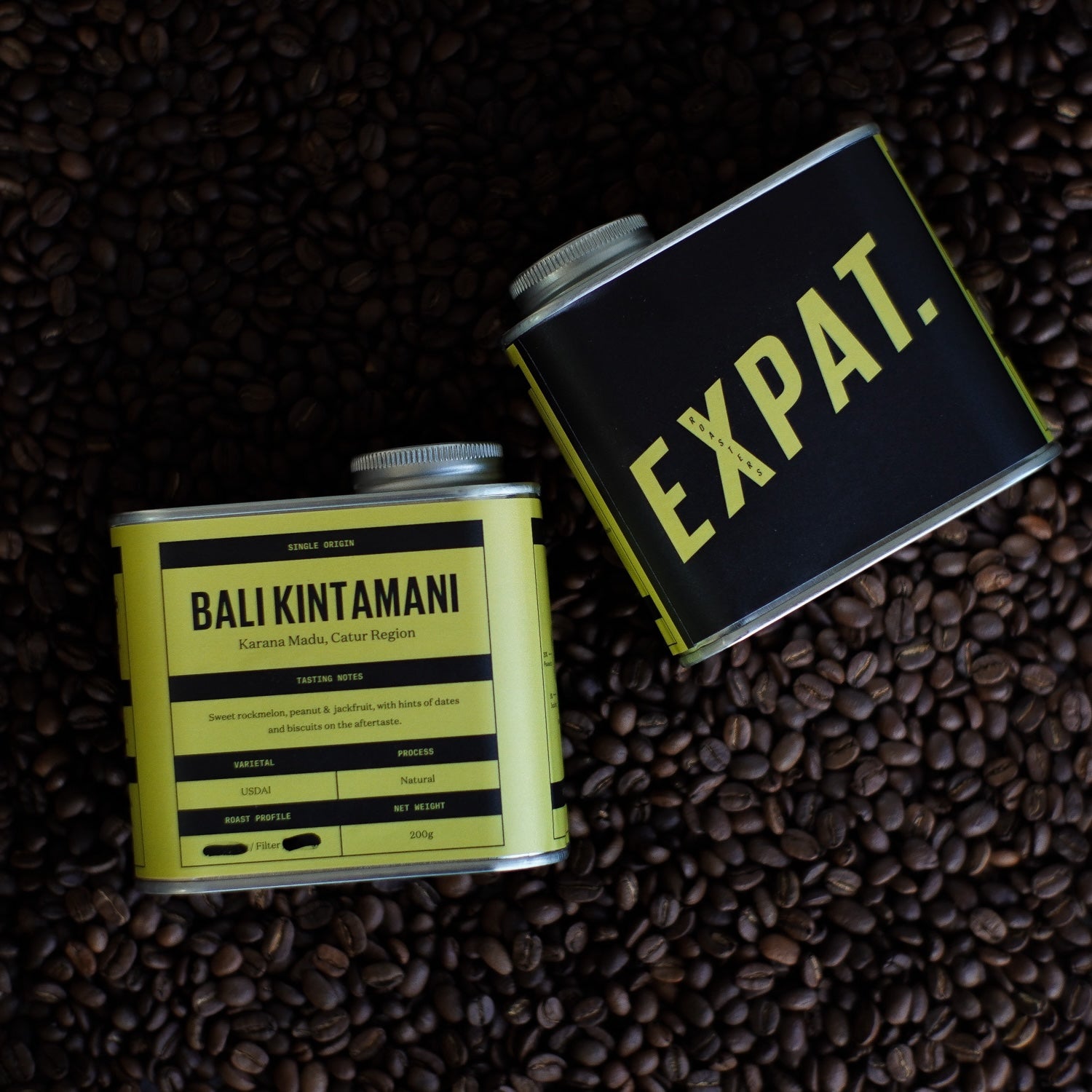 Bali Kintamani coffee Packaging siting on coffee beans in a roaster